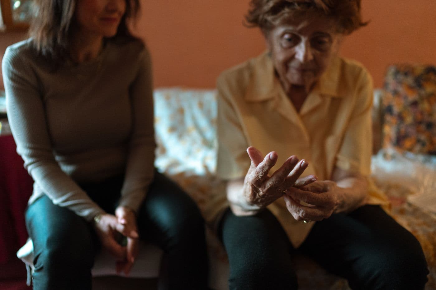 An older woman having a supportive conversation at home